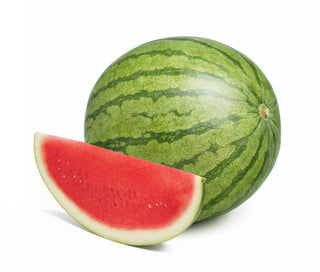 A whole watermelon with a slice cut out to reveal the red flesh, against a white background.